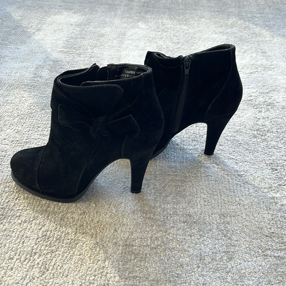 Black suede ankle boots with bows by Restricted.  Excellent condition.